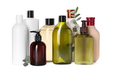 Different bottles of shampoo on white background