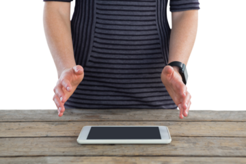 Mid section of businesswoman gesturing over digital tablet