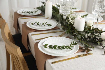 Stylish elegant table setting for festive dinner indoors