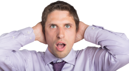 Green eyed businessman with hands covering ears