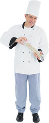 Portrait of smiling chef holding pepper mill