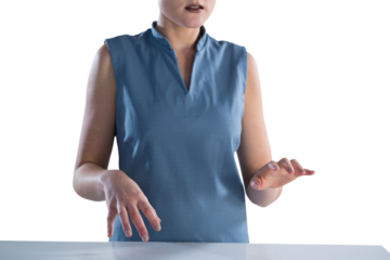 Mid section of businesswoman using imaginary screen at table