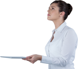 Businesswoman looking up while holding digital tablet