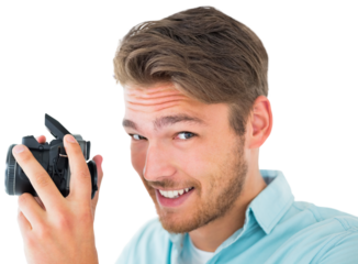 Handsome young man holding digital camera