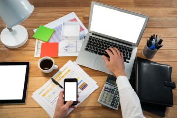 Cropped image of hand working at desk