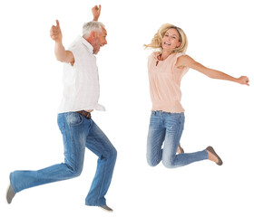 Excited couple cheering and jumping