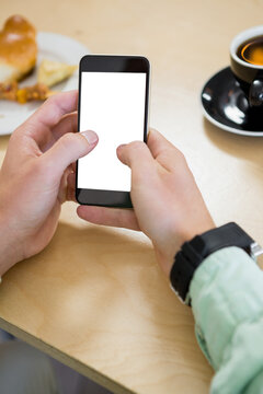 Cropped image of man holding mobile phone