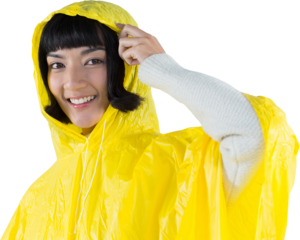 Woman wearing yellow raincoat against white background