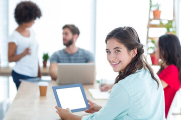 Smiling businesswoman using tablet 