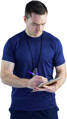 Attentive trainer writing on his clipboard