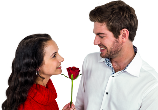 Smiling couple holding rose