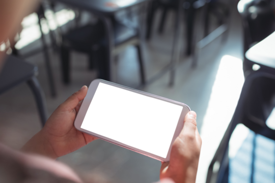 Cropped image of girl holding mobile phone - Powered by Adobe