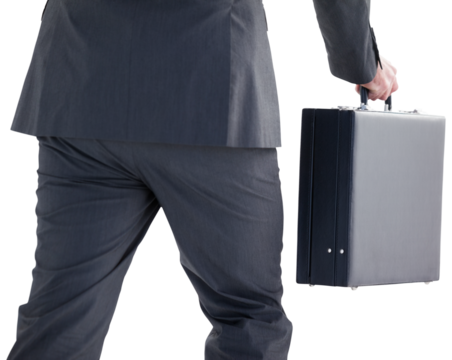 Handsome businessman holding briefcase walking