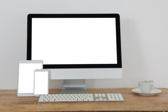Various electronic gadgets and coffee on table