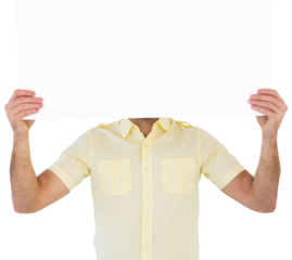 Man holding card in front of his face