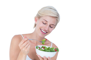 Beautiful blonde woman eating salad