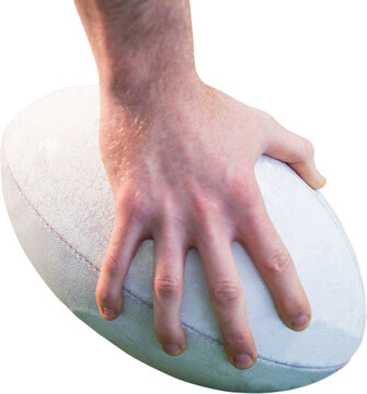 Rugby player posing feet on the ball
