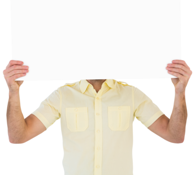 Man holding card in front of his face
