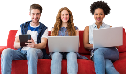 Young adults using electronic devices on couch 