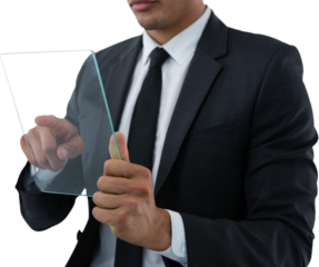 Mid section of businessman touching transparent interface