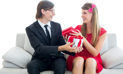 Cute geeky couple smiling and offering gift 