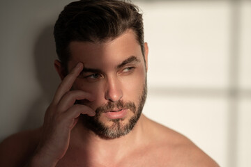 Obraz premium Man close up portrait. Face care of skin. Charming man with perfect smooth soft skin. Spa therapy. Man, face, beauty and skincare concept. Male healthy skin concept.