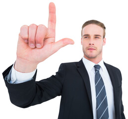 Unsmiling businessman in suit pointing up his finger