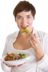 Portrait of beautiful pregnant woman eating salad