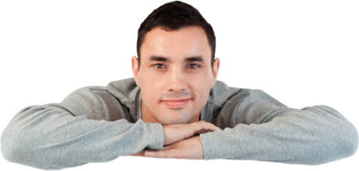 Young male looking over a wall