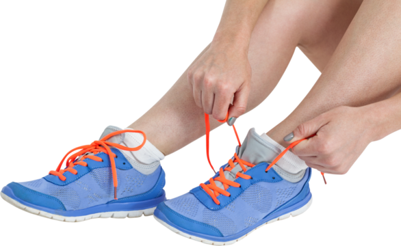 Athlete woman tying her running shoes - Powered by Adobe