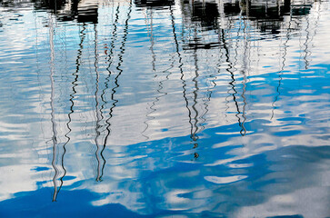Reflections of boats and yachts in the water