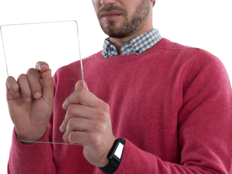 Mid section of man using glass digital tablet