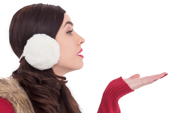 Brunette in winter clothes with hand out - Powered by Adobe