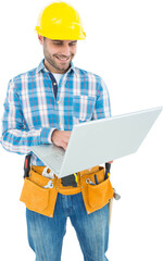 Happy construction worker using laptop