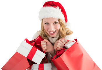 Girl in winter fashion holding presents and shopping bags