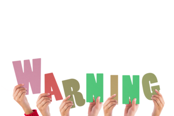 Cropped hands holding colorful alphabets forming warning