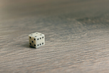 Dice for playing backgammon on a wooden table