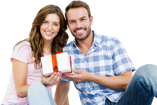Happy young couple holding gift