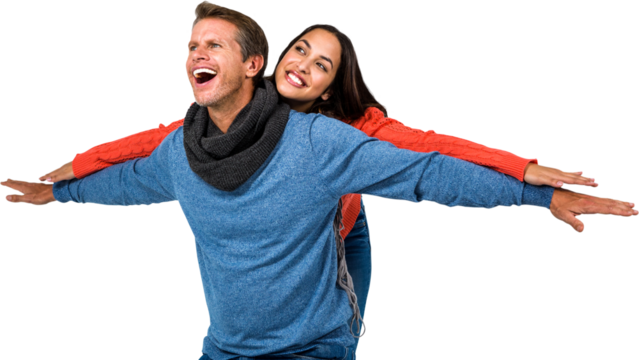 Happy couple with arms outstretched