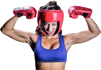 Portrait of angry female boxer flexing muscles
