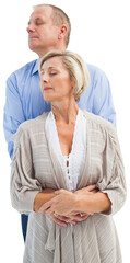 Happy mature couple embracing with eyes closed