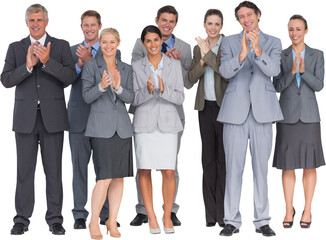 Smiling business team applauding at camera