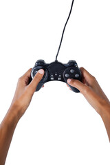 Hands playing video game against white background