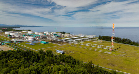 Oil and gas terminal with flaring burning of combustible exhaust gases during petroleum production....