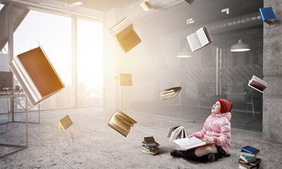 Little girl reading a book