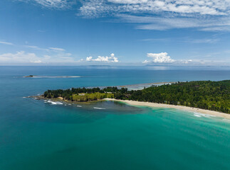 Aerial drone of sandy beach and turquoise water of the tropical sea. Kalampunian beach. Sabah,...
