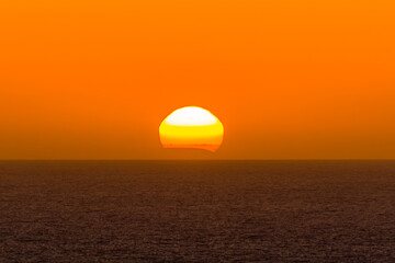 Orange sky sunset over the ocean