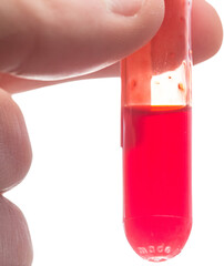Cropped image of person holding test tube with blood 