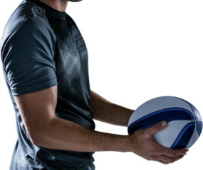Midsection of rugby player holding ball