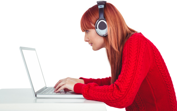 Smiling hipster woman using laptop